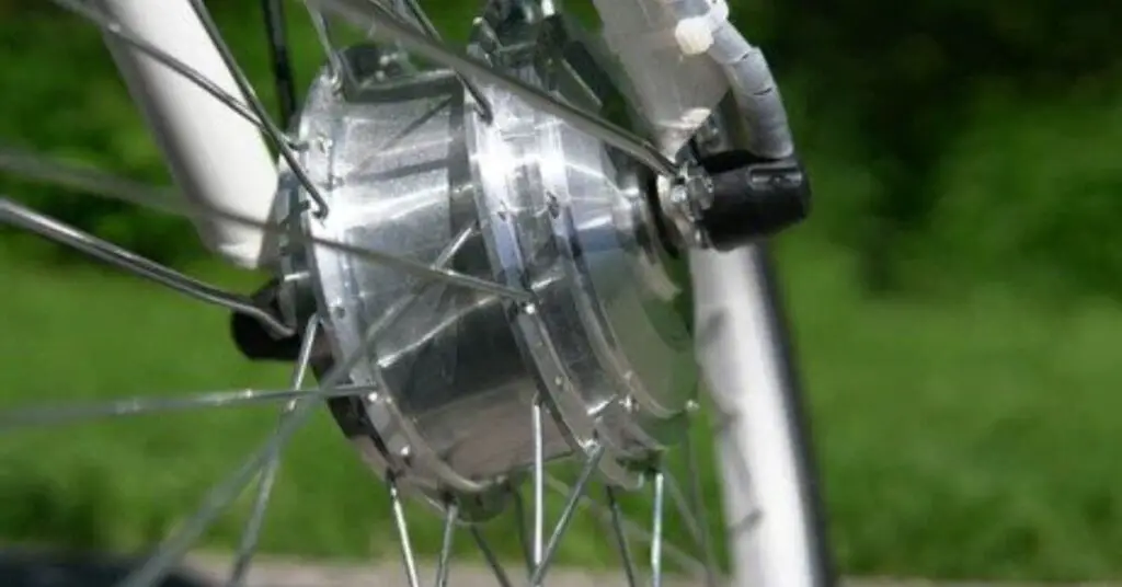 an image of an electric bike front hub motor with a green background