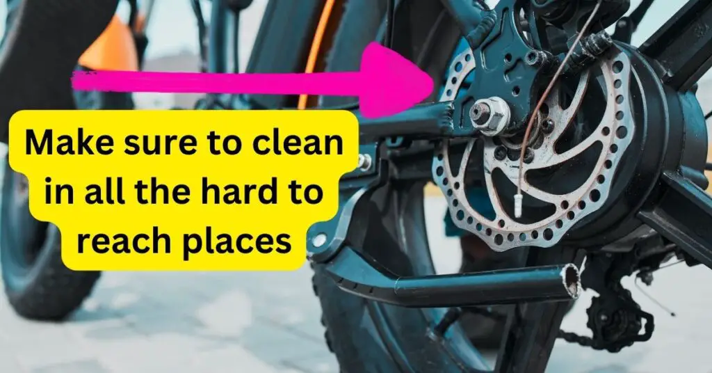 an image of the back wheel of an electric bike and text that says Make sure to clean in all the hard to reach places