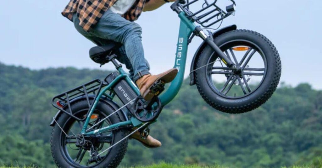 an image of a man riding an engwe l20 electric bike