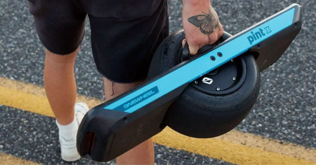 an image of a ONEWHEEL PINT X Electric Skateboard being held in a mans hand